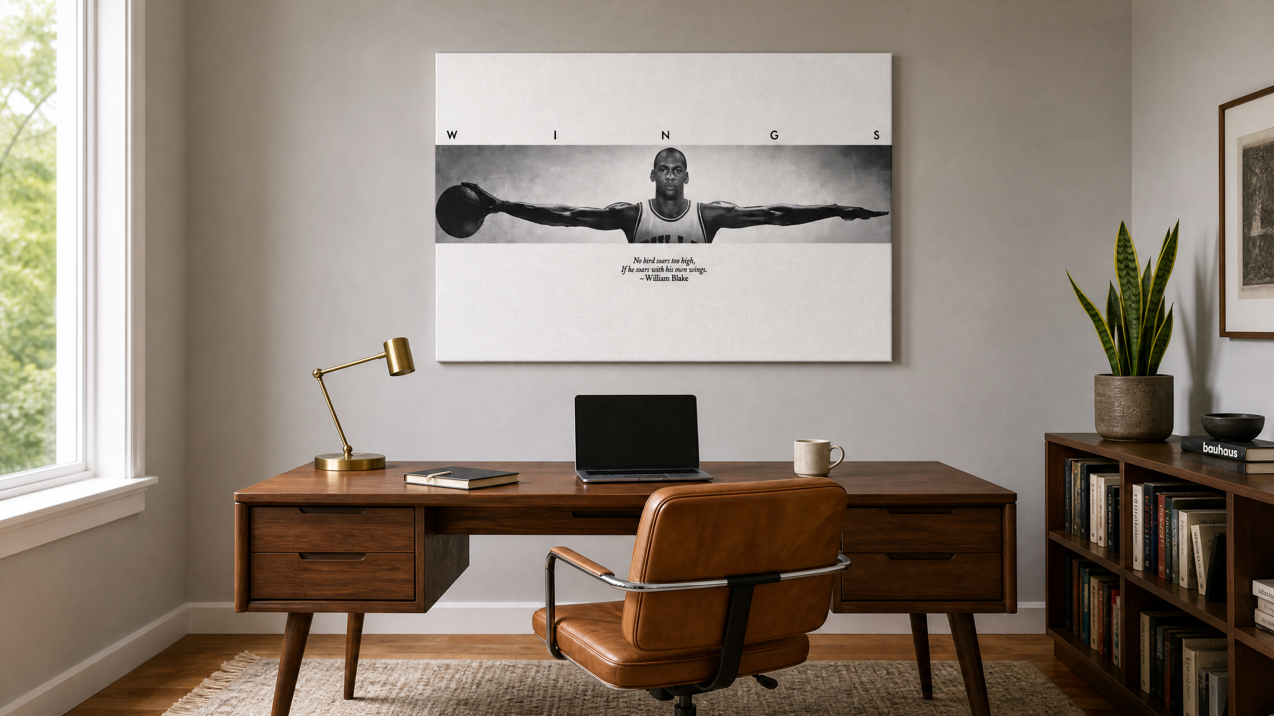 Black and white MJ Wings canvas wall art hanging above a mid-century walnut desk in a modern office