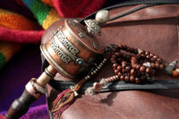 Buddhist prayer wheel and rosary Wall Art